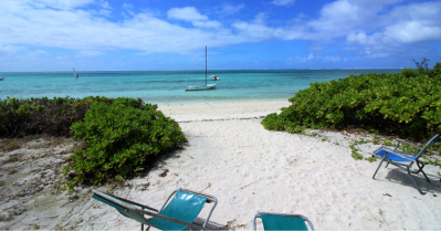 What are the advantages of buying a beachfront villa in Mauritius?